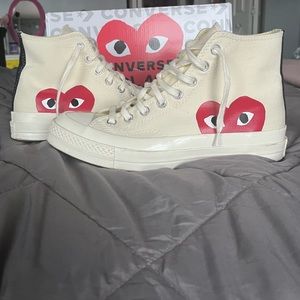Heart Converse, red and white. Size 7 in men’s, size 9 in women’s.